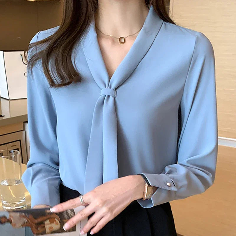 Descubra a Blusa Feminina Elegante com Laço e Decote V. Perfeita para o trabalho e ocasiões especiais. Compre agora, Loja Aiella